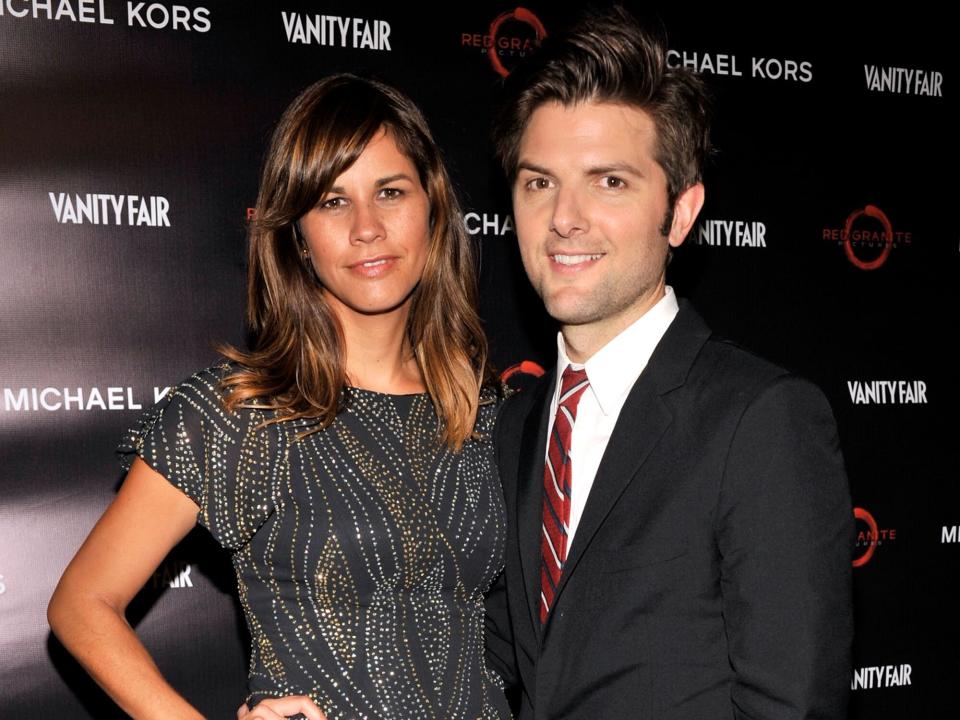 Adam Scott (R) and wife Naomi Sablan attend Toast The Cast Of "Friends With Kids" reception, hosted by Michael Kors, Vanity Fair's Krista Smith and Red Granite Pictures at Jamie Kennedy Center at the Gardiner Museum on September 9, 2011 in Toronto, Canada