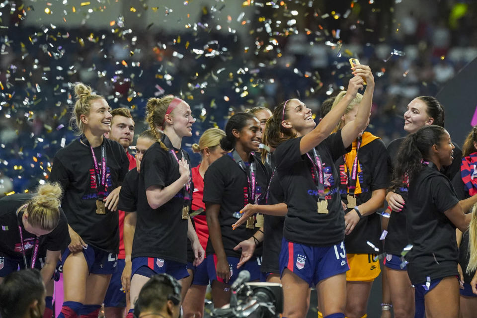 United States' Alex Morgan takes a selfie as she celebrates after winning the CONCACAF Women's Championship final soccer match against Canada in Monterrey, Mexico, Monday, July 18, 2022. (AP Photo/Fernando Llano)