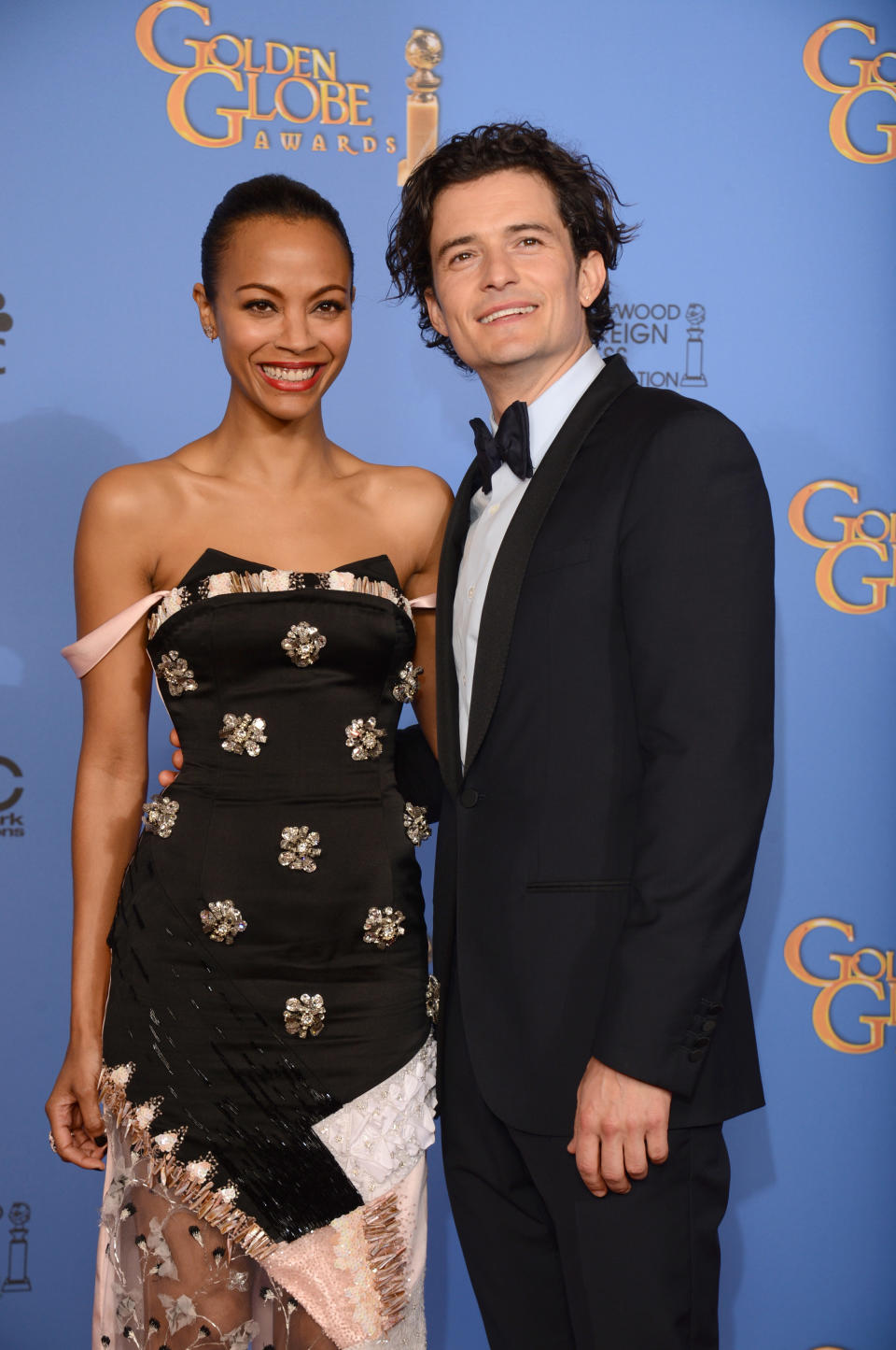 Zoe Saldana, left, and Orlando Bloom pose in the press room at the 71st annual Golden Globe Awards at the Beverly Hilton Hotel on Sunday, Jan. 12, 2014, in Beverly Hills, Calif. (Photo by Jordan Strauss/Invision/AP)