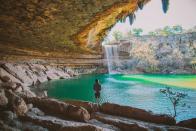 <p>Just a 45-minute drive outside of Austin, the cave formations of the <a href="https://parks.traviscountytx.gov/parks/hamilton-pool-preserve" rel="nofollow noopener" target="_blank" data-ylk="slk:Hamilton Pool Preserve;elm:context_link;itc:0;sec:content-canvas" class="link ">Hamilton Pool Preserve</a> have become a “watering hole” for <a href="https://www.bestproducts.com/parenting/g32894824/durable-kids-hiking-boots/" rel="nofollow noopener" target="_blank" data-ylk="slk:hikers;elm:context_link;itc:0;sec:content-canvas" class="link ">hikers</a> and swimmers looking to escape the city. </p><p>The water is crystal clear where you’ll be able to easily find fish and other creatures. The formations of this preserve were created from the collapse of a cave into Hamilton Creek, with huge limestone cliffs surrounding the pool. Visitors can even walk under a 50-foot waterfall!</p>