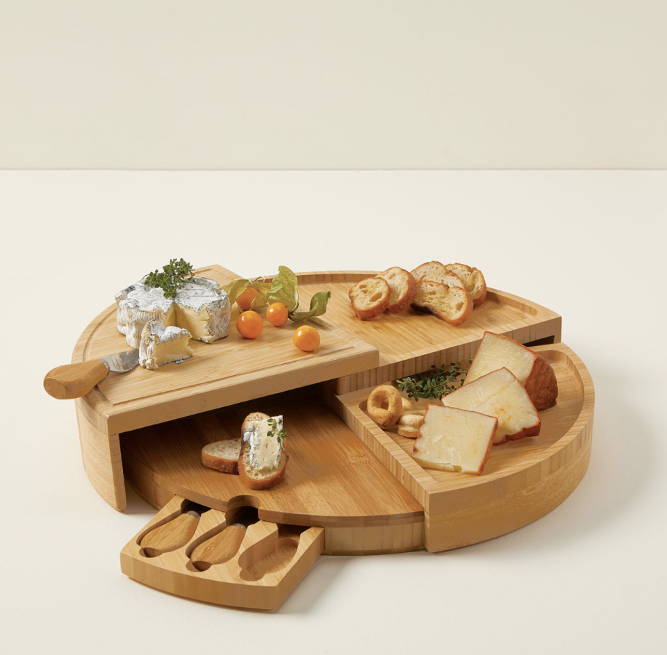 <p><a href="https://go.redirectingat.com?id=74968X1596630&url=https%3A%2F%2Fwww.uncommongoods.com%2Fproduct%2Fcompact-swivel-cheese-board-with-knives&sref=https%3A%2F%2Fwww.countryliving.com%2Fshopping%2Fgifts%2Fg39862858%2Fgifts-for-mom-from-son%2F" rel="nofollow noopener" target="_blank" data-ylk="slk:Shop Now;elm:context_link;itc:0;sec:content-canvas" class="link ">Shop Now</a></p><p>Compact Swivel Cheese Board with Knives</p><p>uncommongoods.com</p><p>$53.00</p><span class="copyright">Uncommon Goods</span>