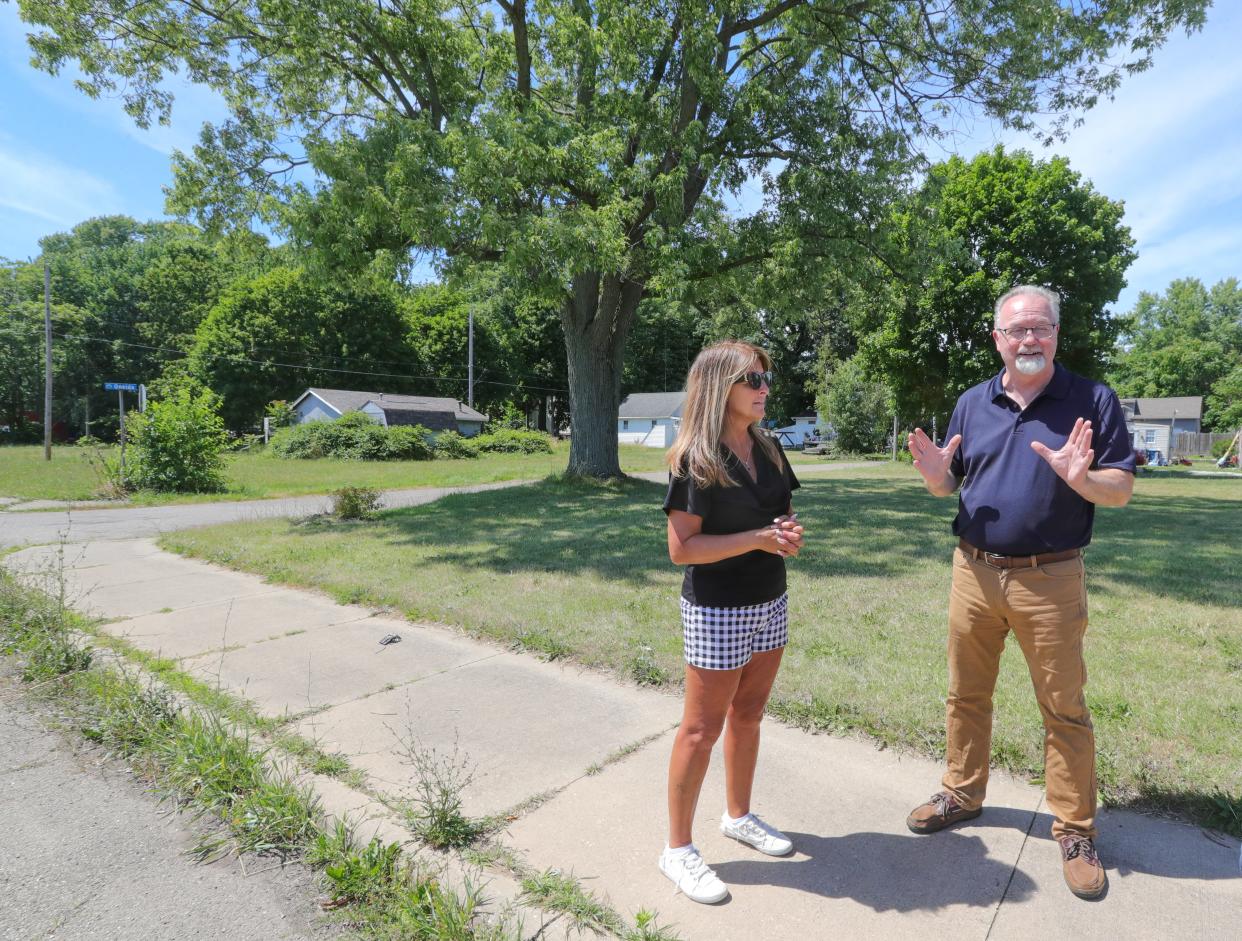 Springfield Township Trustee Kellie Chapman and state Rep. Jack Daniels talk with reporters July 2 about a $250,000 retention pond that will help filter water entering Springfield Lake.