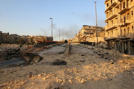 A damaged road is pictured in the rebel held al-Shaar neighbourhood of Aleppo, Syria October 6, 2016. REUTERS/Abdalrhman Ismail