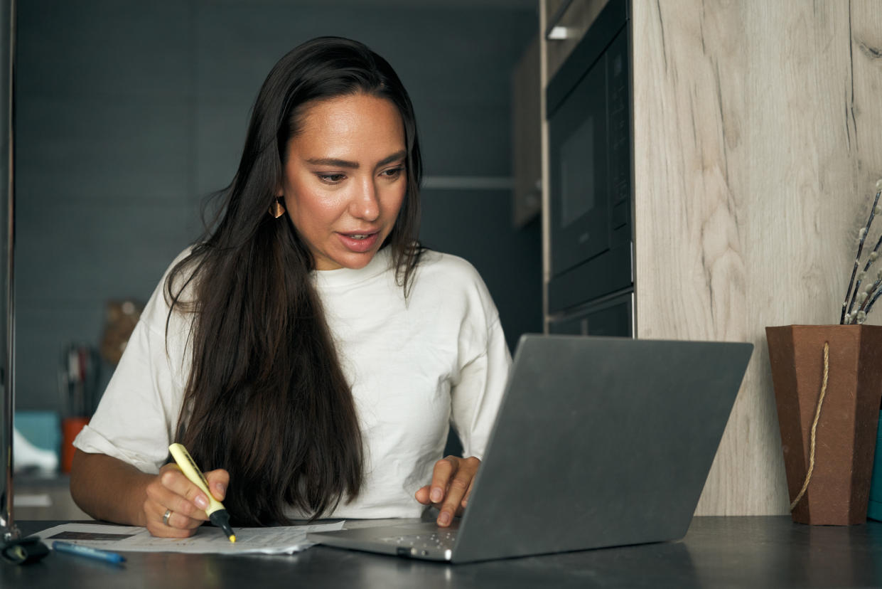 Woman working on laptop at home