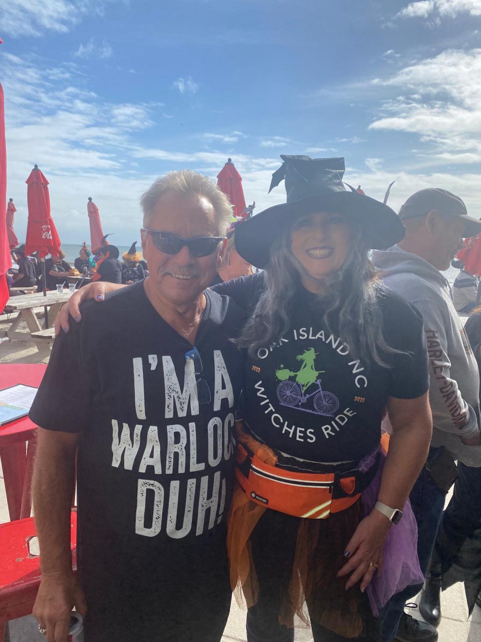 Pete Grendze, Chief of the Oak Island Water Rescue, and Carrie Lenzen, organizer of the annual Oak Island Witches Ride pose for a photo during 2022 event.