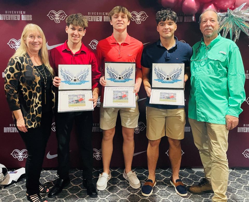 Monroe Memorial Scholarship winners Marco Munera, Jonathan Hatfield and Norbert Csonka with Samuel Monroe and Stacey Monroe.