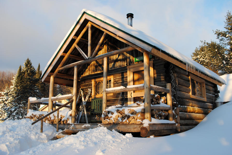 This December 2012 photo shows a rustic cabin in the snow at the Appalachian Mountain Club’s Little Lyford Lodge and Cabins, a backcountry wilderness lodge near Greenville, Maine. In winter, visitors can reach the lodges and cabins only by cross-country skiing in. (AP Photo/Lynn Dombek)
