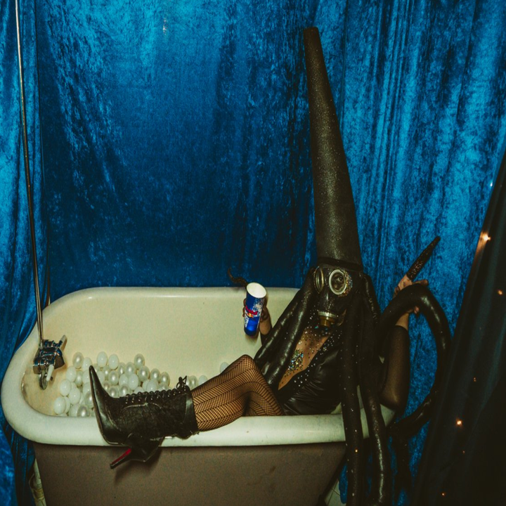 A person in a bathtub in a costume