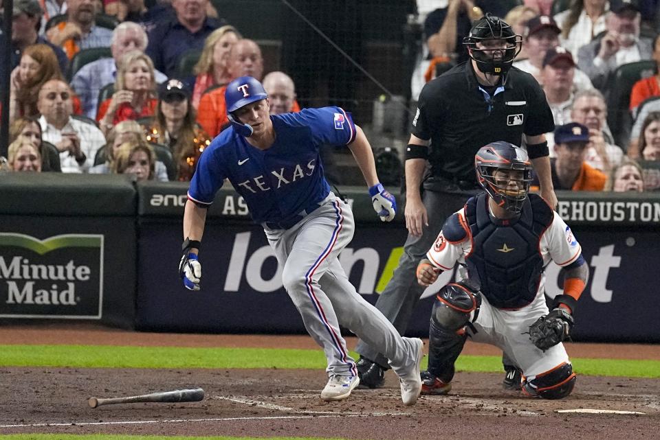 Texas Rangers' Corey Seager hits a double during the second inning of Game 7 of the baseball AL Championship Series against the Houston Astros Monday, Oct. 23, 2023, in Houston. (AP Photo/Tony Gutierrez)