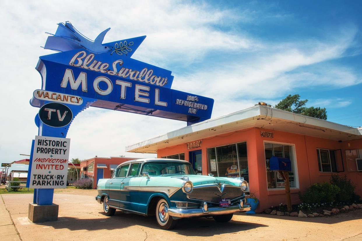 blue swallow motel and vintage car