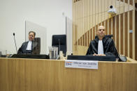 Public prosecutor Ward Ferdinandusse, right, waits for the trial to resume at the high security court building at Schiphol Airport, near Amsterdam, Monday, June 8, 2020, for three Russians and a Ukrainian charged with crimes including murder for their alleged roles in the shooting down of Malaysia Airlines Flight MH17 over eastern Ukraine nearly six years ago. (AP Photo/Robin van Lonkhuijsen, POOL)