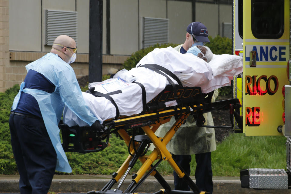 Members of the Henrico County Fire Department Emergency Services transport a patient 