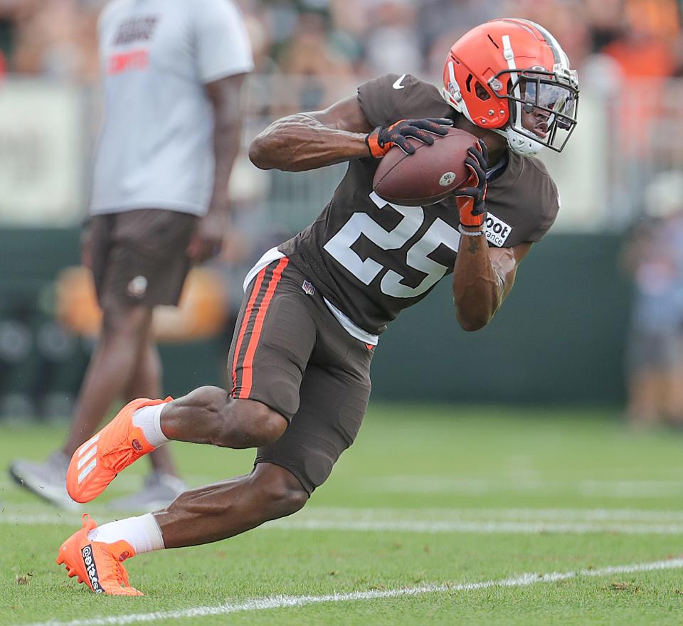 Cleveland Browns receiver Demetric Felton Jr. looks for extra yards after making a catch during training camp on Aug. 5, 2022, in Berea.