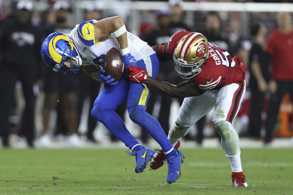 Los Angeles Rams wide receiver Cooper Kupp, left, is tackled by San Francisco 49ers linebacker Dre Greenlaw during the second half of an NFL football game in Santa Clara, Calif., Monday, Oct. 3, 2022. (AP Photo/Jed Jacobsohn)