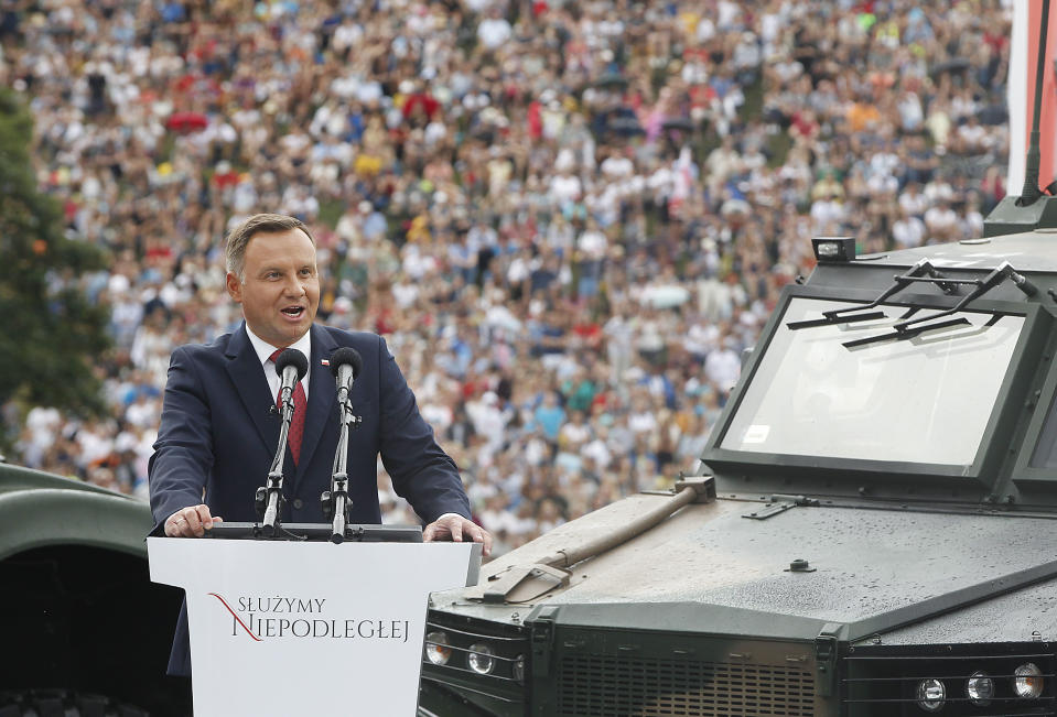 Poland's President Andrzej Duda speaks at the start of Polish National Army Day parade in Warsaw, Poland, Wednesday, Aug. 15, 2018.Poland's president voiced hope for a permanent U.S. military presence in his country as the country put on a large military parade on its Army Day .(AP Photo/Czarek Sokolowski)