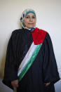 FILE - In this Tuesday, March 29, 2016, photo, Islamic court judge Kholoud al-Faqeeh poses for a portrait during a break at the court in Ramallah, West Bank. In 2009, she became one of the first two women appointed as religious court judges. She sees her presence on the court as all the more important since it rules on matters ranging from divorce and alimony to custody and inheritance. (AP Photo/Dusan Vranic, File)