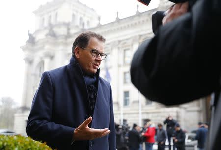 Christian Social Union (CSU) member Gerd Mueller arrives for exploratory talks at the German Parliamentary Society about forming a new coalition government in Berlin, Germany, November 16, 2017. REUTERS/Axel Schmidt