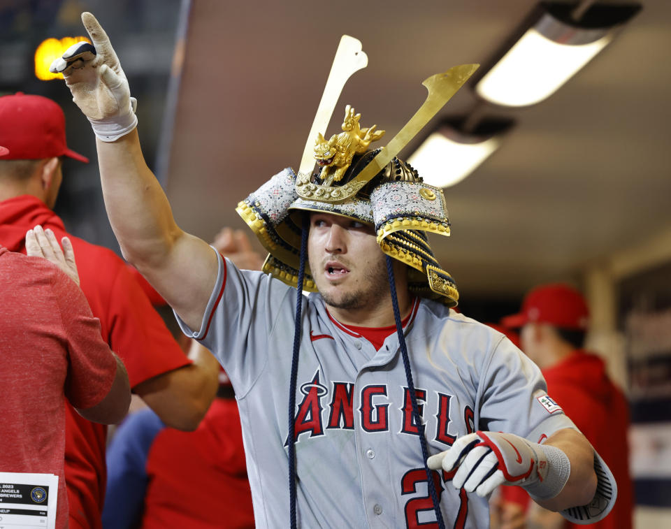 Los Angeles Angels' Mike Trout reacts in the dugout after his two-run home run in the ninth inning of a baseball game against the Milwaukee Brewers, Saturday, April 29, 2023, in Milwaukee. (AP Photo/Jeffrey Phelps)