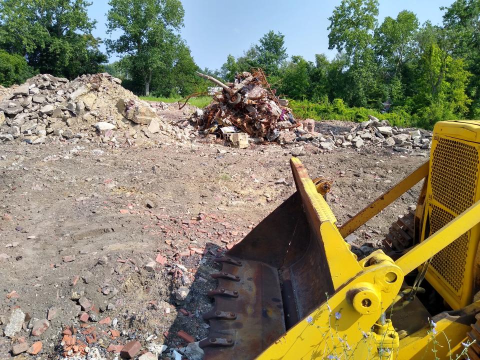 Rubble remains on Morgan Avenue as workers continue to clear the site of the former L.E. Shunk Latex Products factory in South Akron.