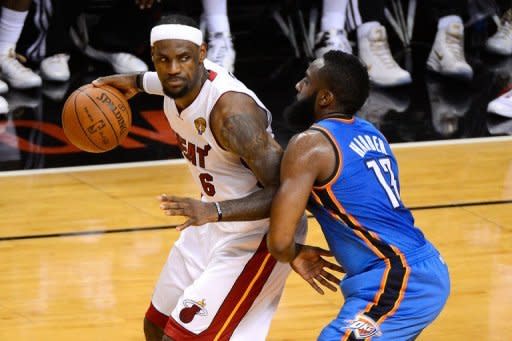 Miami Heat's LeBron James (L) and Oklahoma City Thunder's James Harden during game four of their 2012 NBA Finals on June 19. The Heat rallied to beat Thunder 104-98 to move within one victory of the NBA title