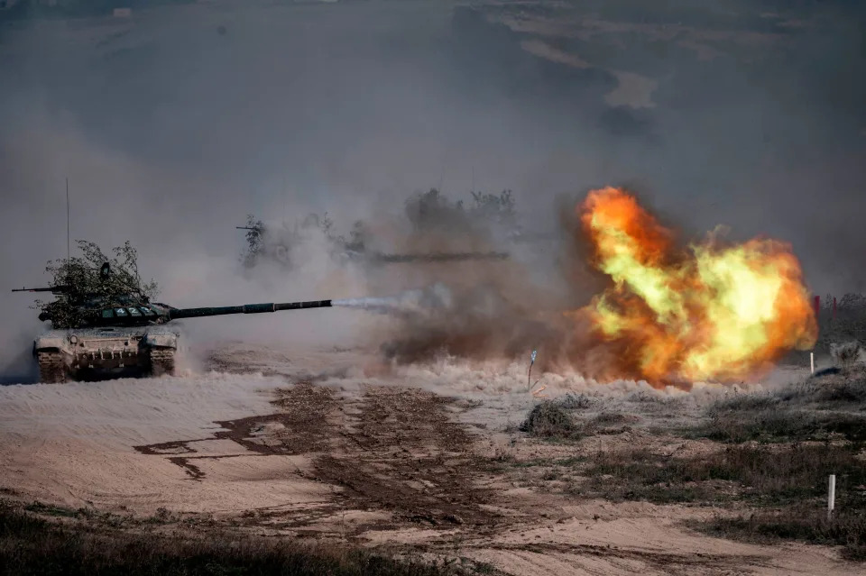 A Russian army T-72-B3 tank fires during military exercises at the Raevsky range in Southern Russia on September 23, 2020 during the "Caucasus-2020" military drills gathering China, Iran, Pakistan and Myanmar troops, along with ex-Soviet Armenia, Azerbaijan and Belarus.