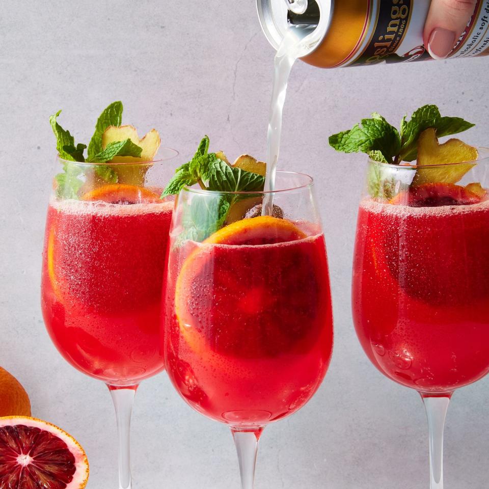 blood orange mocktail with a blood orange slice, mint, and ginger