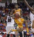 Tennessee guard Jordan McRae (52) shoots against Massachusetts forward Sampson Carter (22) during the second half of an NCAA college basketball second-round tournament game, Friday, March 21, 2014, in Raleigh, N.C. (AP Photo/Chuck Burton)