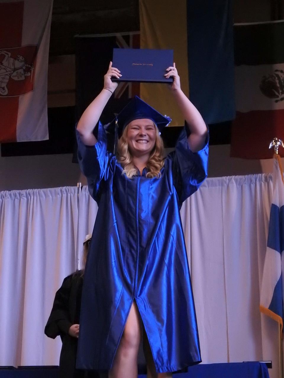 Marissa Schilling, who received a bachelor's degree in nursing, was the last graduate on stage Sunday, May 7, 2023, at Finlandia University in Hancock, Mich. The school closed after more than 100 years, due to low enrollment, debt and other challenges.