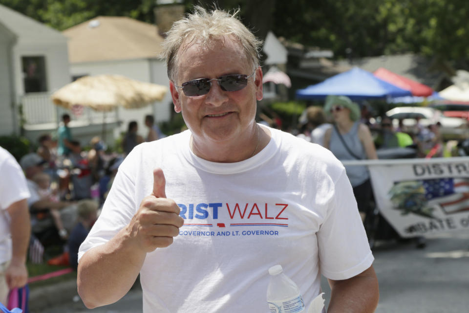 In this July 4, 2018, photo, then-Democratic gubernatorial candidate and former state Sen. Bob Krist gives the thumbs-up as he campaigns during a Fourth of July parade in Ralston, Neb. Krist recently endorsed Republican Rep. Don Bacon over his own party's Kara Eastman for the state's only competitive congressional seat. (AP Photo/Nati Harnik)