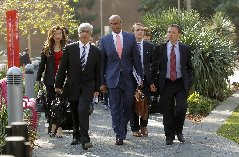 Attorneys Theodore Boutrous, second form left, and Marcellus McRae, third from left, representing nine California public school students who are suing the state to abolish its laws on teacher tenure, seniority, and other protections, walk to a news conference outside the Los Angeles Superior Court Monday, Jan. 27, 2014 in Los Angeles. Their case Vergara v. California is the latest battle in a growing nationwide challenge to union-backed protections for teachers. (AP Photo/Nick Ut)