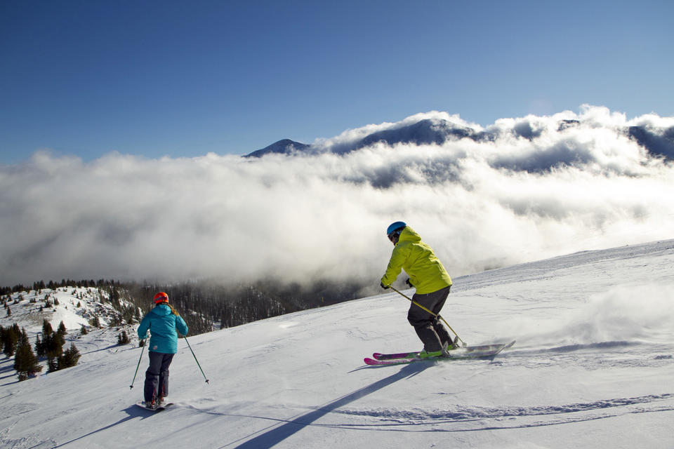 This Jan. 26, 2012 photo provided by Colorado Ski Country USA shows a skiers on the slopes at Winter Park, Colo. A disappointing snow year in much of Colorado ski country last season has the state's resorts and hotels hoping that snowboarders and skiers will burn off some pent-up demand for deep snow this winter. (AP Photo/Colorado Ski Country USA/Brad Torchia)