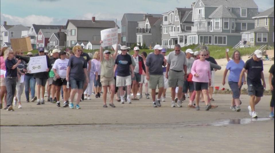 Advocates for allowing expanded public use of intertidal spaces across Maine's beaches march on Moody Beach on Saturday, Aug. 19, 2023.