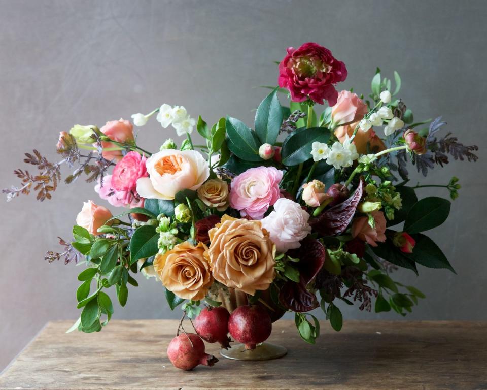 <p>For a bountiful appearance, add branches of pomegranates to the bottom of your centerpiece arrangement, and echo their hue in an accent bloom. This arrangement also incorporates neutral-toned flowers to anchor the many colors present in the centerpiece. </p><p><em>Via <a href="http://tulipina.com/" rel="nofollow noopener" target="_blank" data-ylk="slk:Tulipina;elm:context_link;itc:0;sec:content-canvas" class="link ">Tulipina</a></em></p>