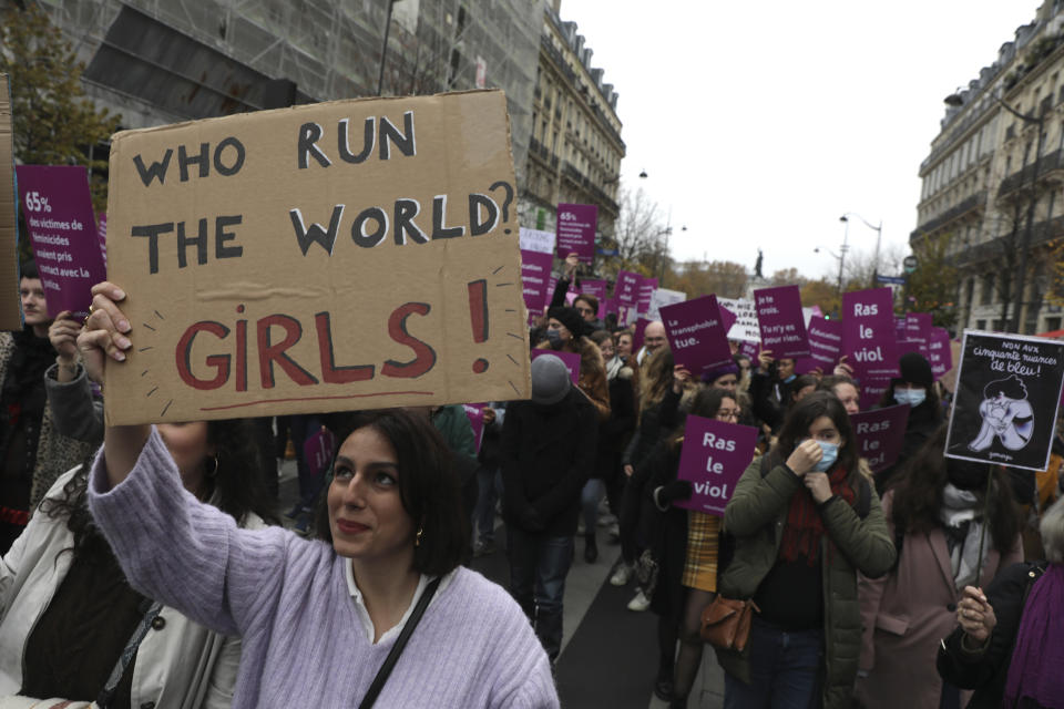 FILE - Women demonstrate against violence against women, Nov. 20, 2021 in Paris. French Junior Interior Minister Marlene Schiappa said France must further help women victims of violence to report abuses to the police, including via a new process to file a complaint at a friend’s home or in a place where they feel safe. (AP Photo/Adrienne Surprenant, File)