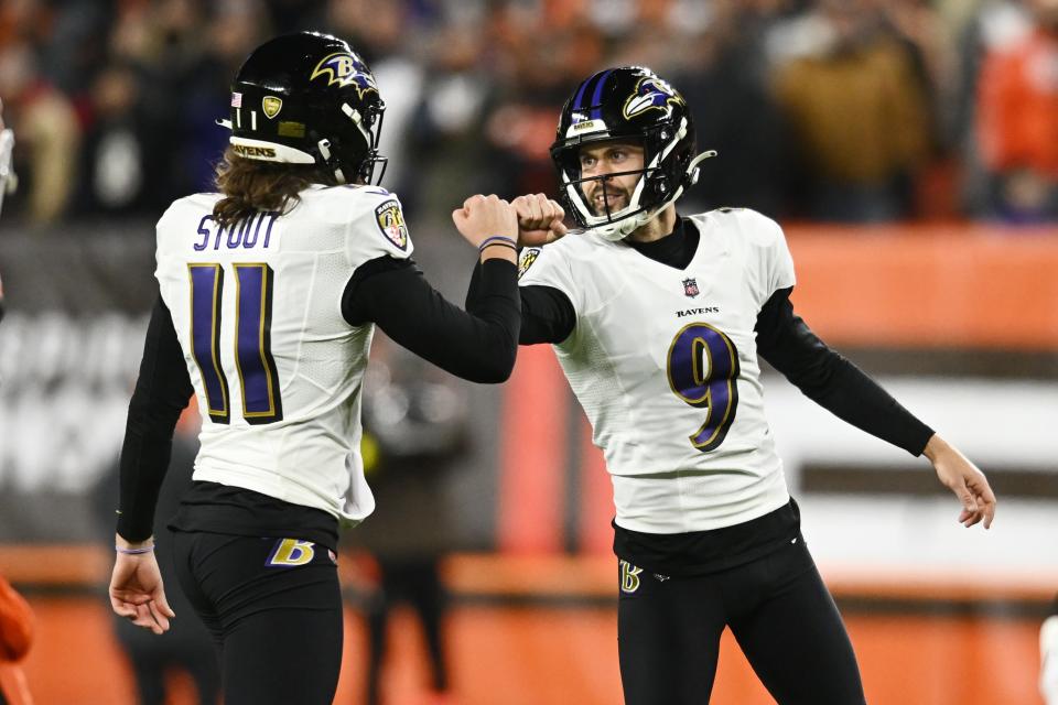 Dec 17, 2022; Cleveland, Ohio, USA; Baltimore Ravens place kicker Justin Tucker (9) celebrates with holder Jordan Stout (11) after kicking a field goal during the first half against the Cleveland Browns at FirstEnergy Stadium. Mandatory Credit: Ken Blaze-USA TODAY Sports