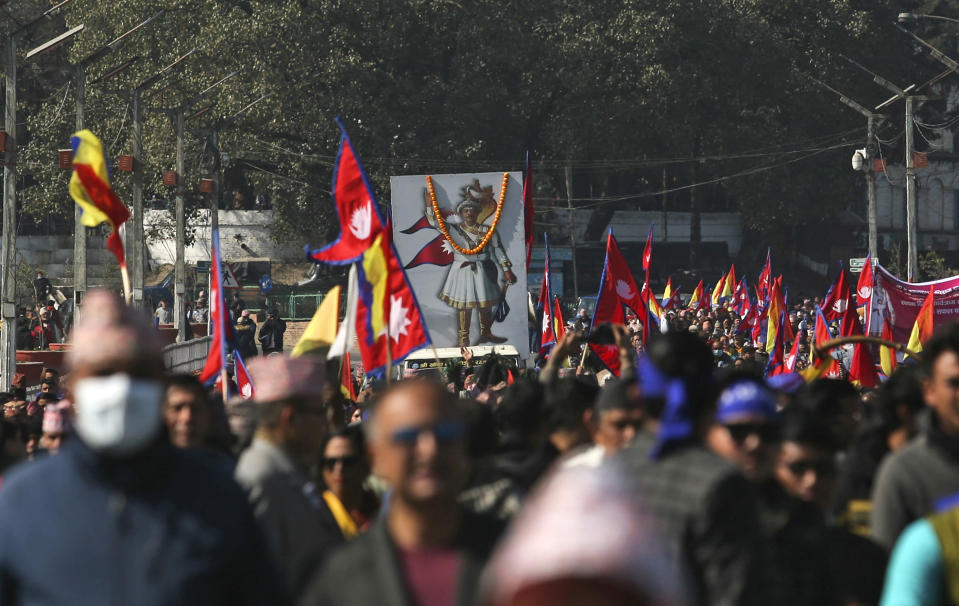 People participate in a rally to mark the birth anniversary of King Prithvi Narayan Shah, who started the Shah dynasty in the 18th century, in Katmandu, Nepal, Wednesday, Jan. 11, 2023. Thousands of supporters of Nepal’s former royal family held a rally Wednesday demanding the restoration of monarchy in the Himalayan nation. The last Shah king, Gyanendra, was forced to step down and the monarchy abolished in 2008, making Nepal a republic. (AP Photo/Bikram Rai)