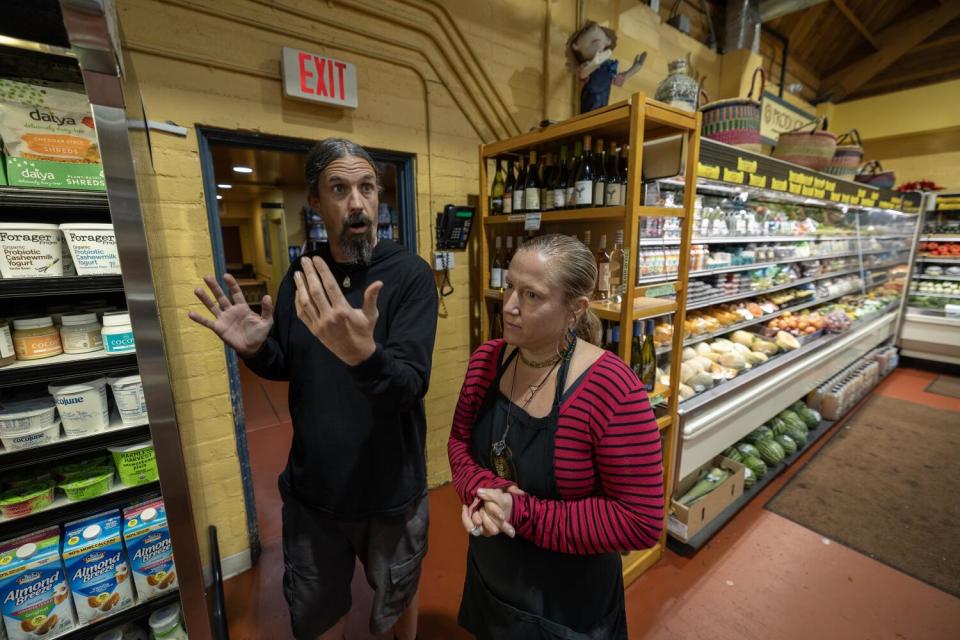 Andrew Shaw, left, manager, and Amy Allen, cashier, at Rainbow bridge natural