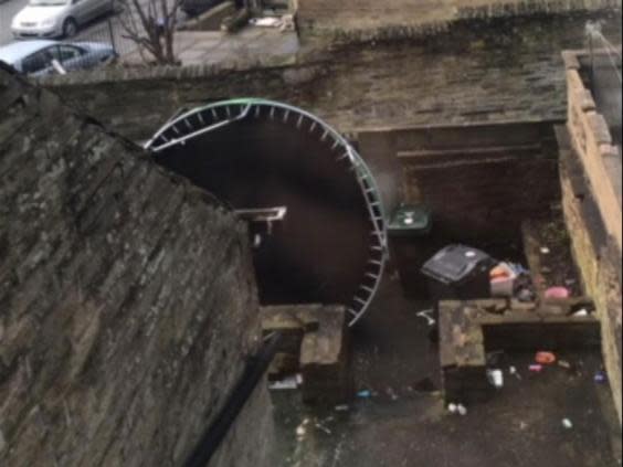 More vandalism: a trampoline on its side at the home of a Huddersfield grooming gang victim (Supplied)