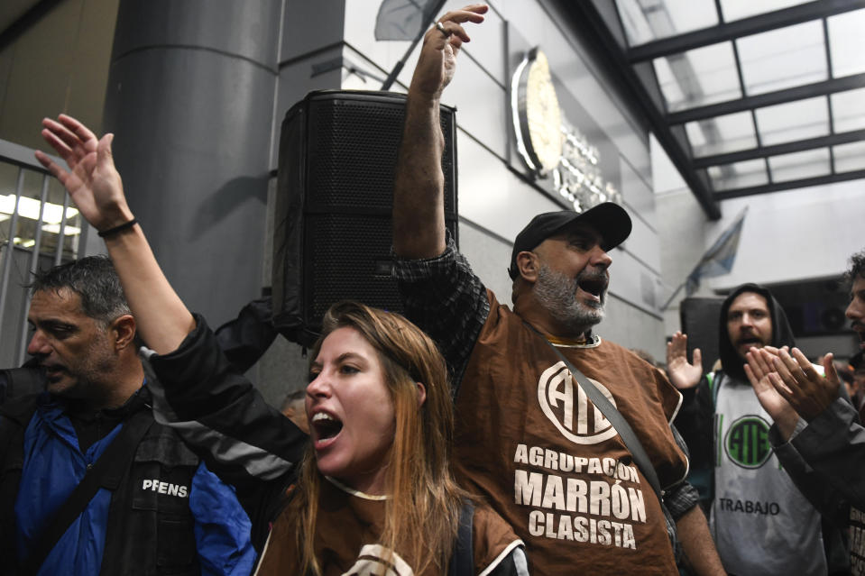 Demonstrators chant slogans during an anti-government protest after some workers were laid off as part of state economic downsizing measures, in Buenos Aires, Argentina, Wednesday, April 3, 2024. (AP Photo/Gustavo Garello)