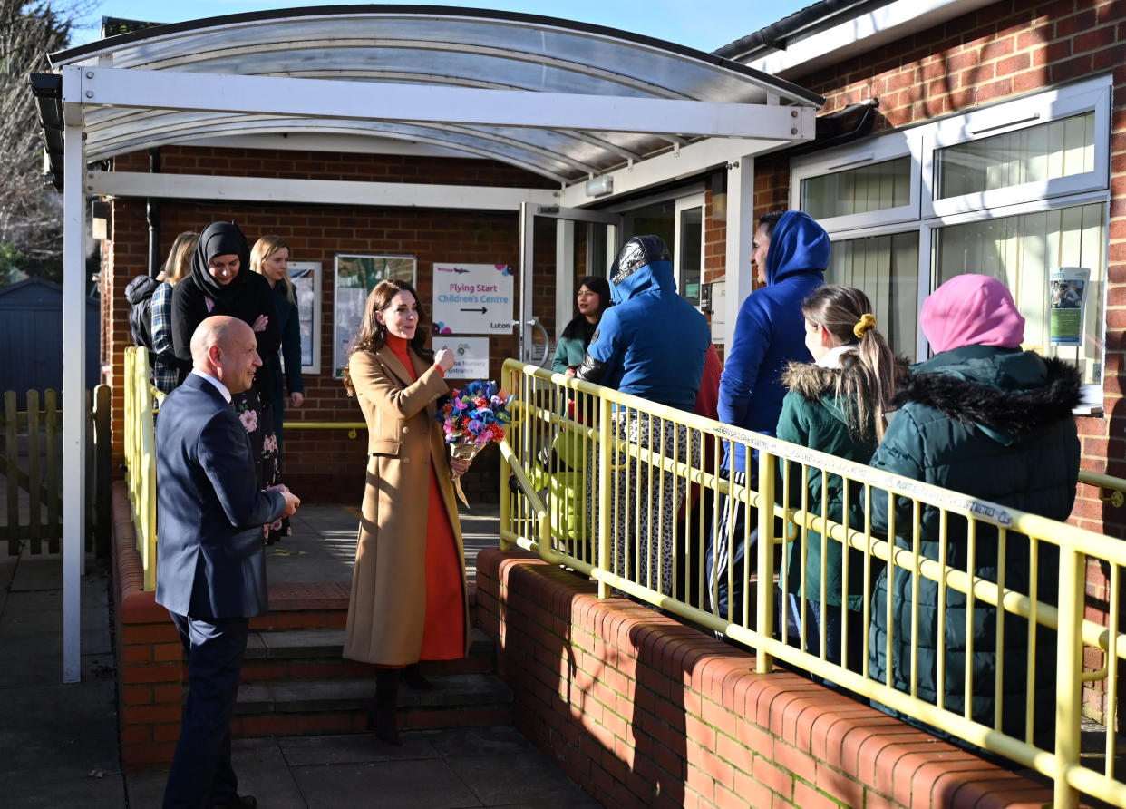 Princess of Wales talks with parents  after visiting the Foxcubs Nursery 