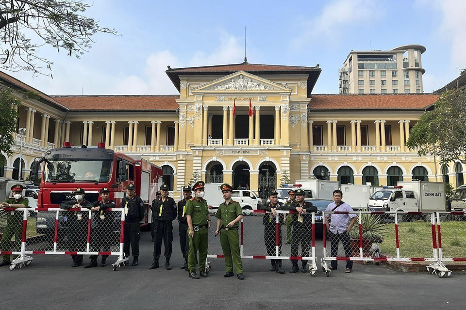Police guard the entrance to a courthouse in Ho Chi Minh City, Vietnam Tuesday, March 5, 2024, where Vietnamese businesswoman Truong My Lan stands trial. Lan faces the death penalty in a trial that began Tuesday over alleged fraud amounting to $12.5 billion, nearly 3% of the country’s 2022 GDP. (Hoang Anh Tuan/VNA via AP)