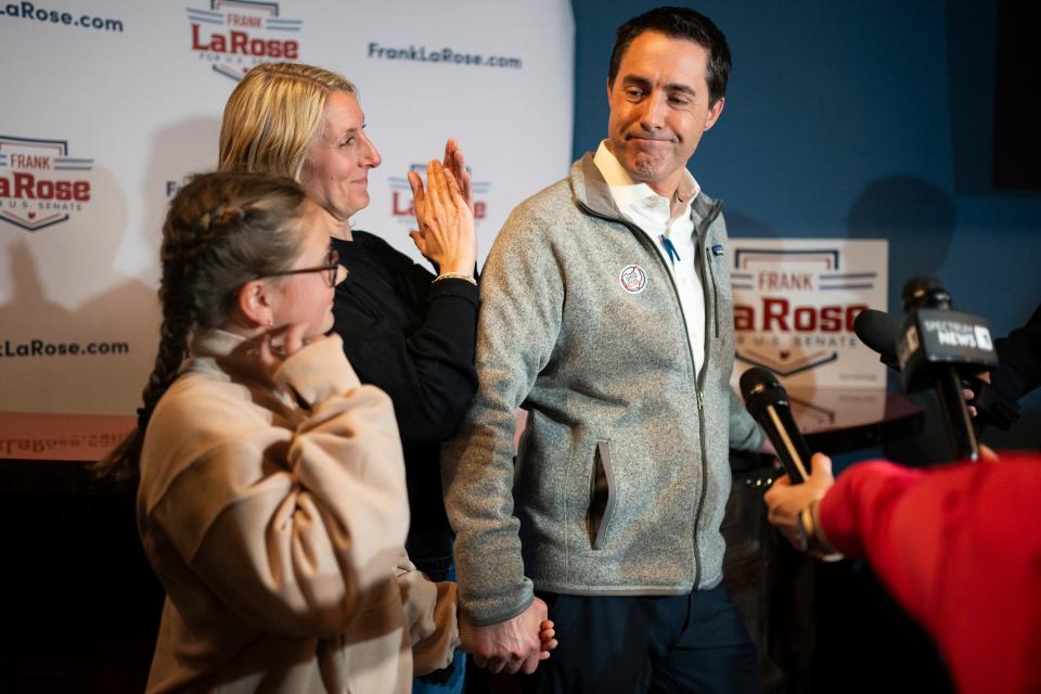 Mar 19, 2024; Columbus, Ohio, US; Secretary of State Frank LaRose concedes his run for the U.S. Senate, while his wife and middle daughter stand at his side at Grandview Cafe.
