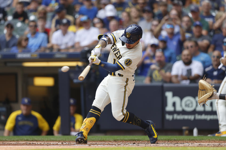 Milwaukee Brewers' Milwaukee Brewers second baseman Kolten Wong hits a double against the Pittsburgh Pirates during the third inning of a baseball game Wednesday, Aug. 4, 2021, in Milwaukee. (AP Photo/Jeffrey Phelps)