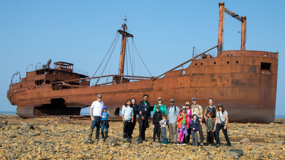 A group of parents and children on a tour with Frontiers North Adventures walks to the wreck of the Ithaca. - Alex Cupeiro/Fronters North Adventures