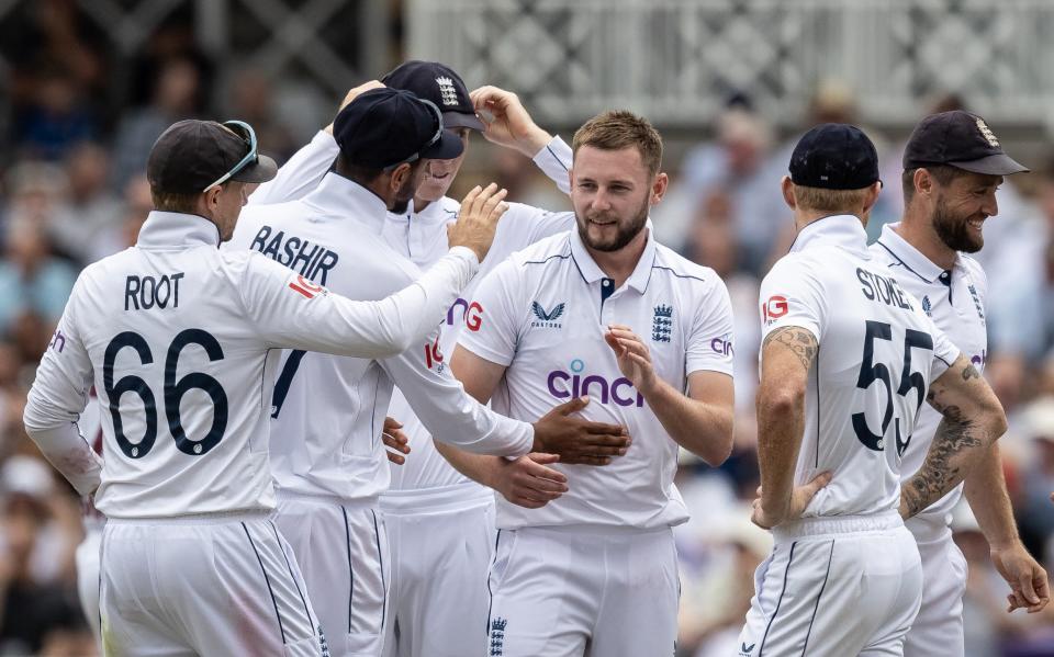 Gus Atkinson celebrates the wicket of Kevin Sinclair