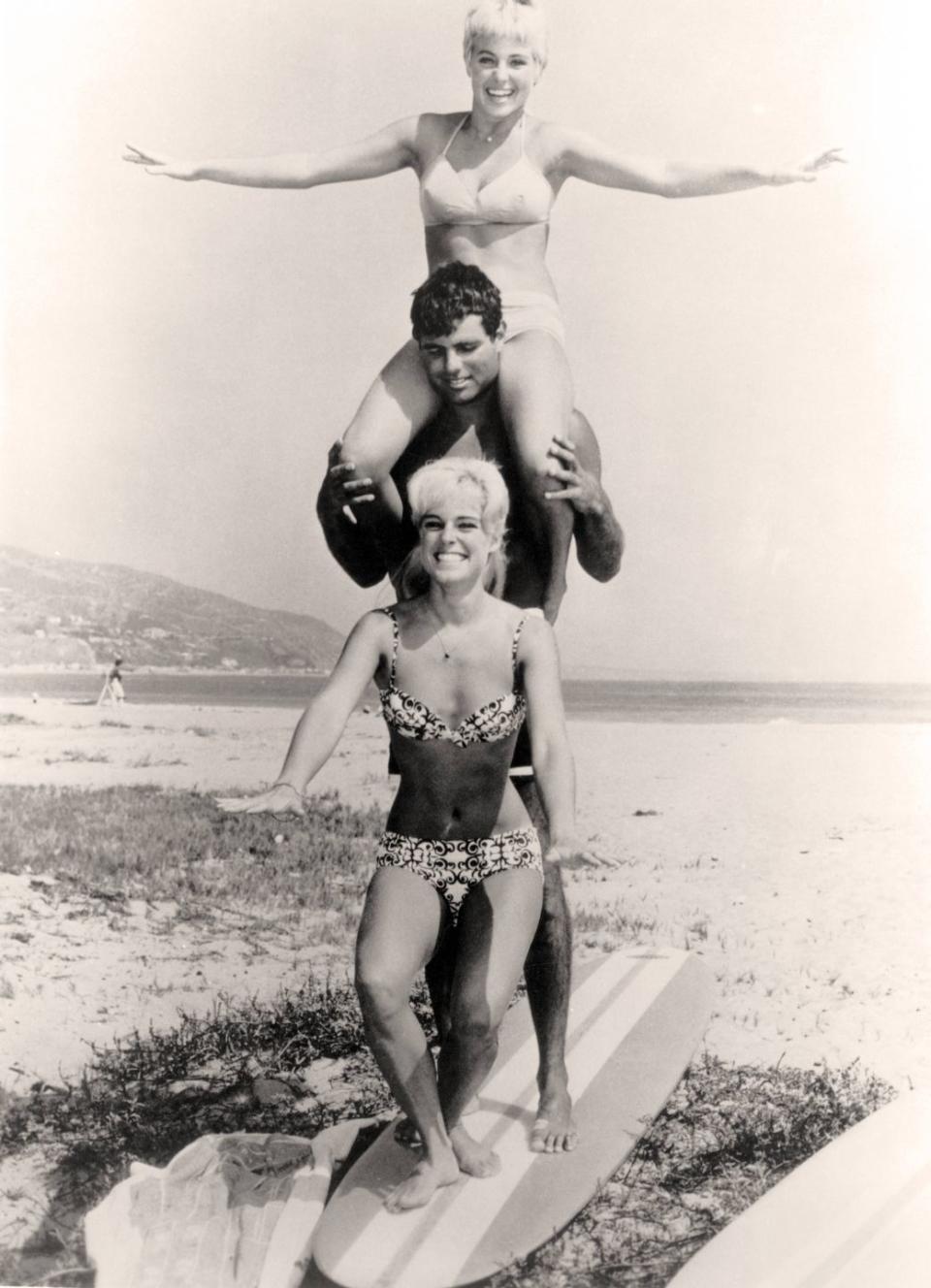 Posing on a surfboard: circa 1970