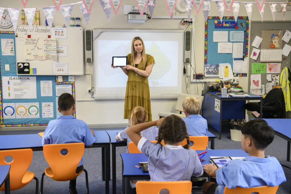 Teacher and students in a school classroom