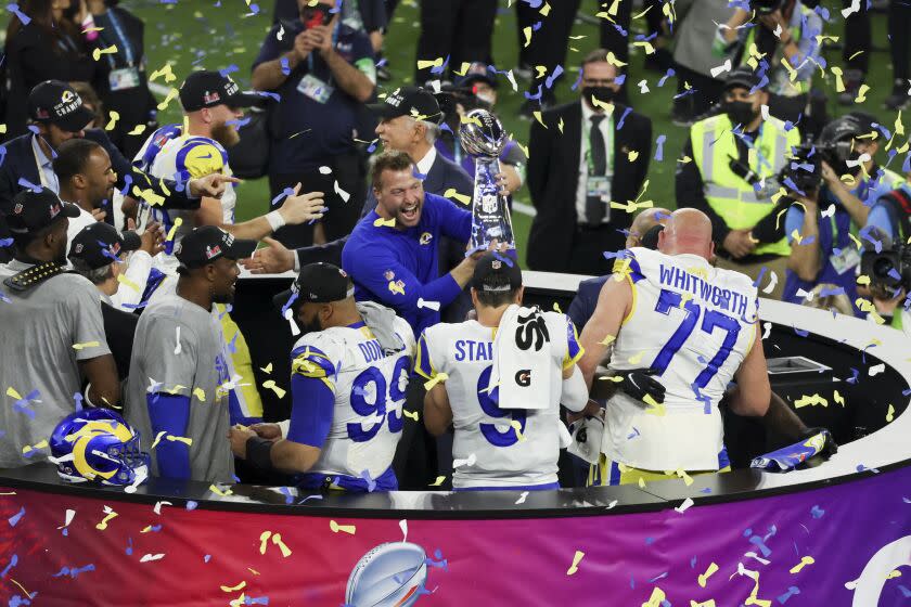 Inglewood, CA - February 13: Los Angeles Rams head coach Sean McVay holds the Lombardi Trophy.