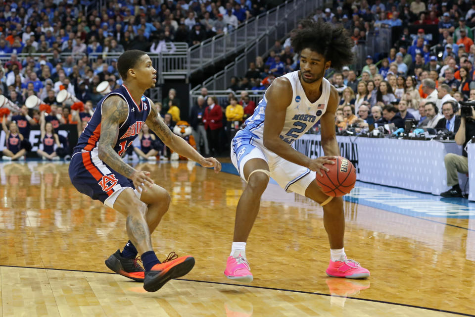 KANSAS CITY, MO - MARCH 29: North Carolina Tar Heels guard Coby White (2) keeps the ball away from Auburn Tigers guard J'Von McCormick (12) in the second half of an NCAA Midwest Regional Sweet Sixteen game between the Auburn Tigers and North Carolina Tar Heels on March 29, 2019 at Sprint Center in Kansas City, MO.  (Photo by Scott Winters/Icon Sportswire via Getty Images)