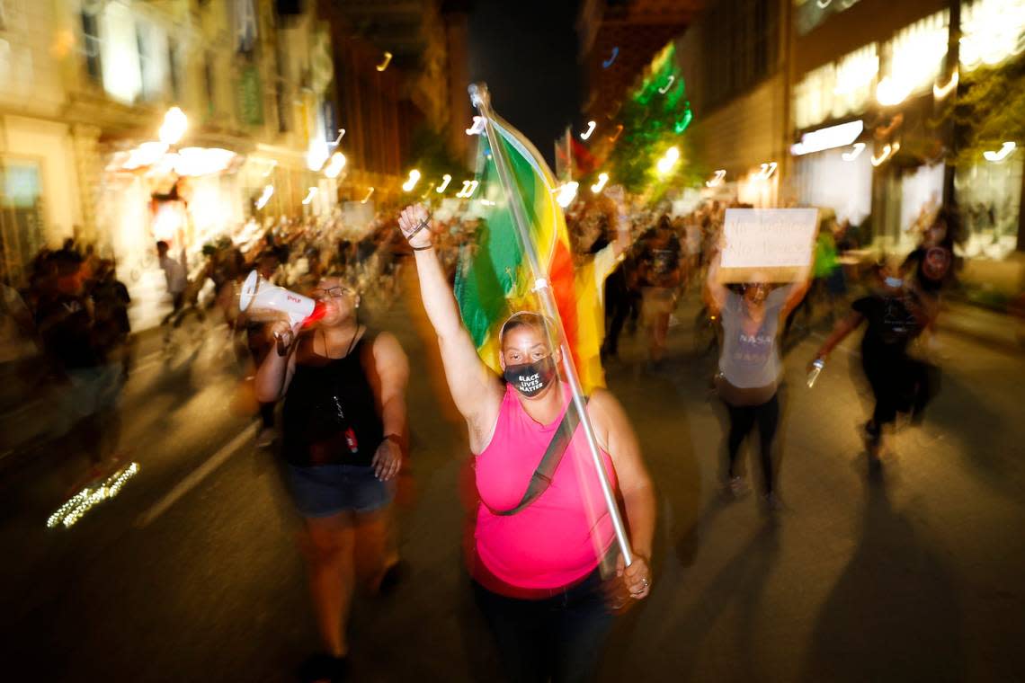 Sarah Williams leads demonstrators down East Main Street during the eighth night of protests in downtown Lexington, Ky., Friday, June 5, 2020. The protests come amid a nationwide outcry over the deaths of George Floyd in Minneapolis and Breonna Taylor in Louisville.